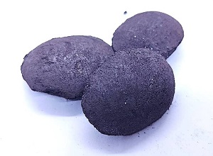 Silicon briquette 70% appearance showing typical pillow-shaped briquette,dark gray color,smooth surface texture