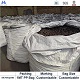 Silicon carbide briquette in bags at factory,showing products in woven bags and factory warehouse background
