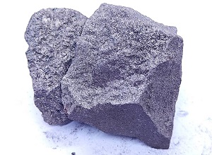 Silicon manganese 60/28 grade (SiMn 6028) lump appearance showing metallic luster, silver-gray color, typical irregular lump shape